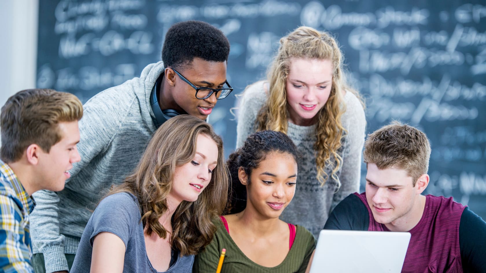 Students looking at the computer